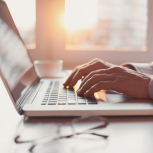 person typing on laptop computer